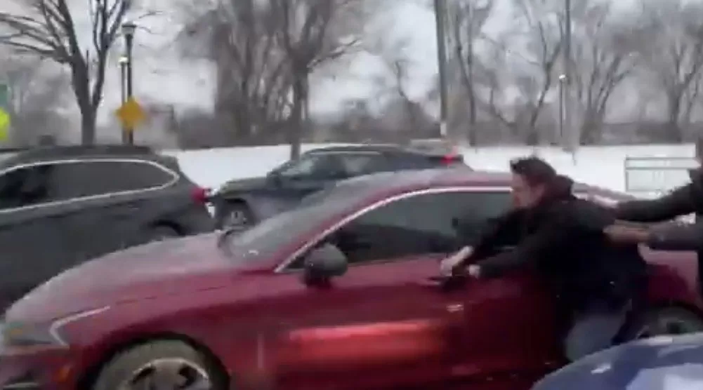 WATCH: Somali Woman Robs Independent Journalist Nick Sortor in Minneapolis Then Drives Off, Dragging Him Down the Street Before Leftists Surround and Threaten Him – FBI Responds!